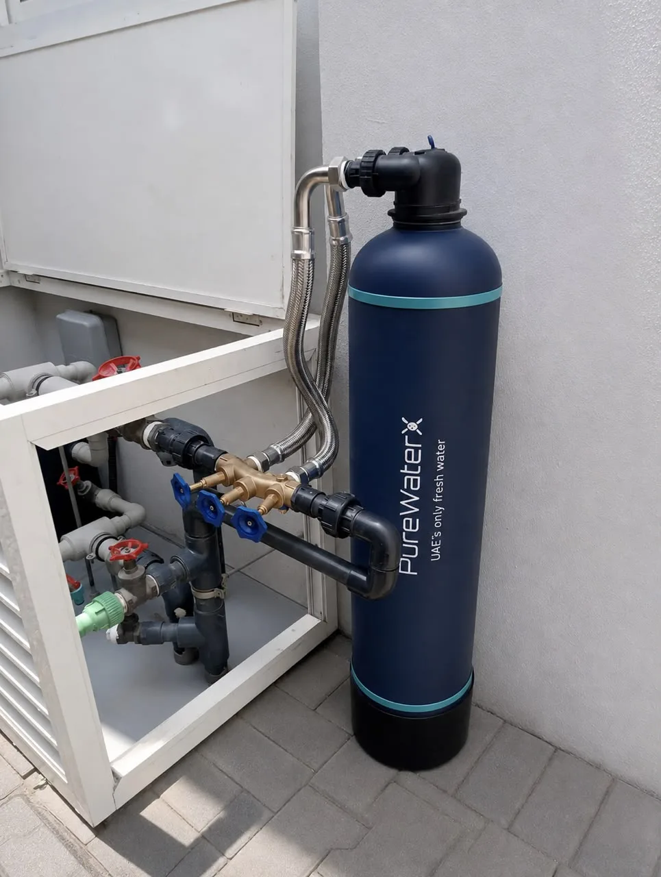 Pure X Home whole-house water filtration system installed at the main water entry of a UAE villa